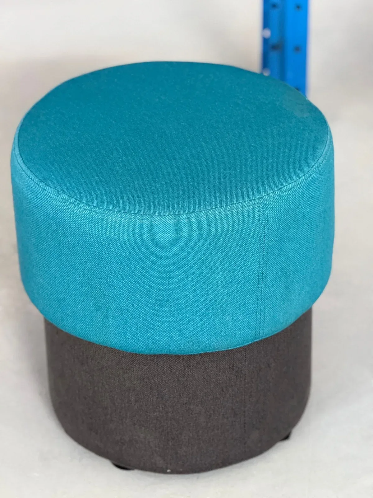 Teal and charcoal upholstered stool from Warebid's pre-owned furniture catalogue